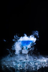 blue cocktail  and ice vapor
