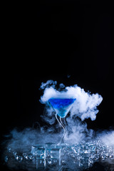 blue cocktail  and ice vapor