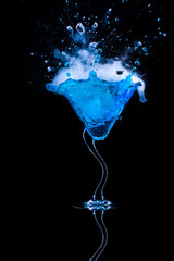 blue cocktail  and ice vapor