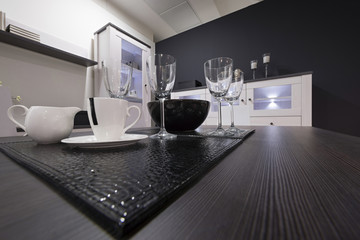 Black wooden table with wine glasses