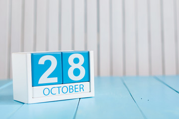 October 28th. Image of October 28 wooden color calendar on white background. Autumn day. Empty space for text
