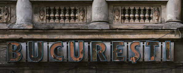 Bucharest - bucharest sign on an old building.
