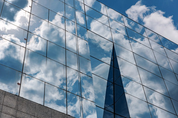 Fototapeta na wymiar Business building with cloud reflections.