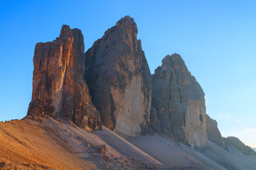Tre Cime di Lavaredo in beautiful surroundings at sunset in the