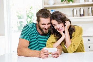 Obraz na płótnie Canvas Couple using mobile phone