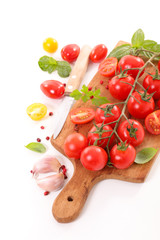 cherry tomato and basil on board