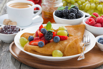 crepes with fresh berries and honey, coffee for breakfast