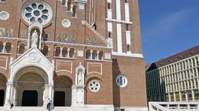 SZEGED, HUNGARY - MAY 22, 2016: Votive Church of Our Lady of Hungary in Szeged. Construction began in 1913 and it was completed at 1930. 4K footage.