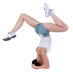 young woman dancing, headstand isolated in full body on white
