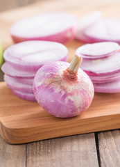 Shallots (red onion) on wood table

