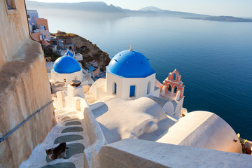 Churches and stairs in Oia, Santorini. Shot at sunset. Horizontal view. - obrazy, fototapety, plakaty