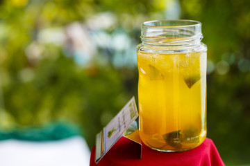 glass jar with fruit juice and ice