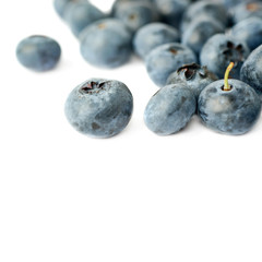 Pile of Bilberry or blueberry over isolated white background