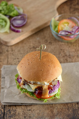 Beef burger on a piece of brown paper