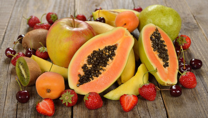 Fresh papaya and various fruits