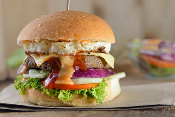 Close up of burgers on wooden background
