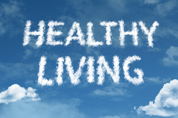 Naklejka na ściany i meble Healthy Living cloud word with a blue sky
