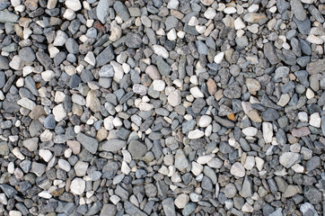 A background pattern of black and white stones