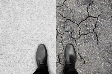 Black shoes standing on carpet and earth