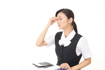 頭痛を訴えるビジネスウーマン