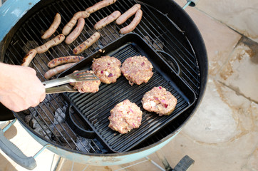 Cooking homemade burgers on the BBQ