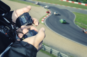 A racing stopwatch timing the cars