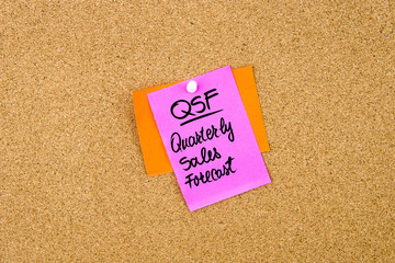 QSF Quarterly Sales Forecast written on paper note