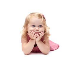 Young little girl lying over isolated white background