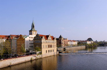 Fototapeta na wymiar National theater in background, sunny day in the Prague, river Vltava