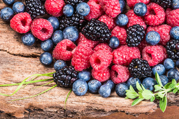 Fresh berries, blueberry, raspberry, blackberry closeup background.