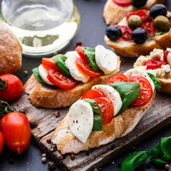Bruschetta with tomatoes, mozzarella and basil