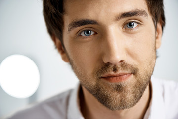 Obraz premium Close up portrait of elegant confident handsome young businessma