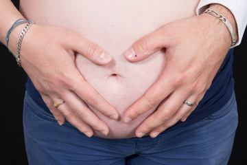 Heart Shaped Pregnancy, parents making a heart with hands