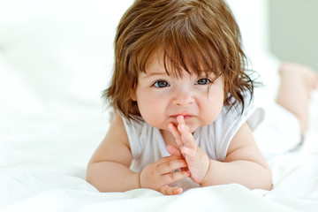 Fototapeta premium Happy baby on the bed 