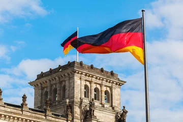 German Reichstag in Berlin, Germany, with national flags © Christian Müller