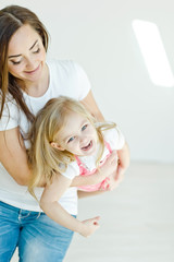 mother with daughter  on the floor 