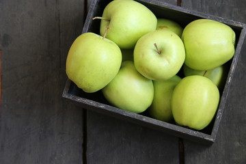 green apples on a black table