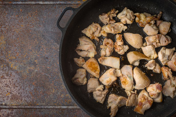 Fried chicken in the pan top view