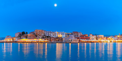 Panoramic view of Venetian quay of Chania with Kucuk Hasan Pasha Mosque during twilight blue hour, Crete, Greece