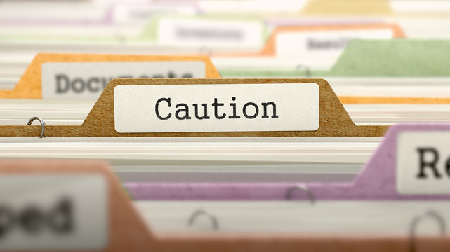 File Folder Labeled as Caution in Multicolor Archive. Closeup View. Blurred Image. 3D Render.