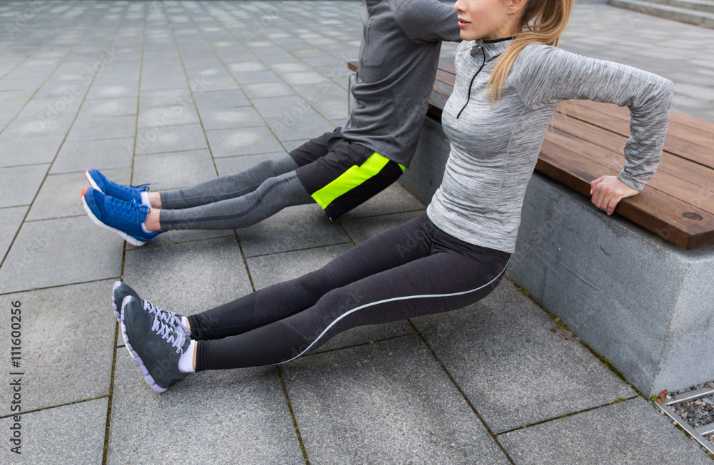 Sticker close up of couple doing triceps dip on bench