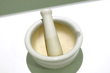 White mortar  and  pestle for grinder.