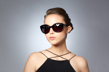 beautiful young woman in elegant black sunglasses