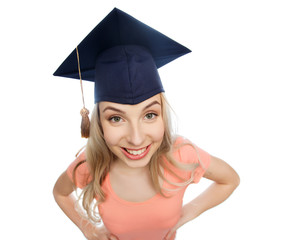 smiling young student woman in mortarboard