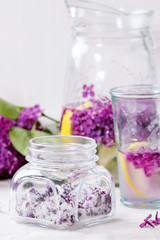 Obraz na płótnie Canvas Lilac flowers in sugar
