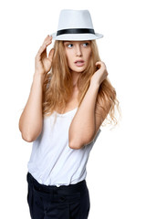 Beautiful slytish woman posing in fedora hat