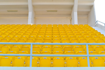 Yellow seats in football stadium