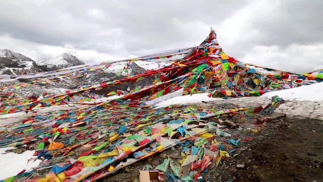 mountain peak with colorful prey flad