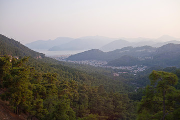 Evening view of the city of Marmaris, the mountains and the sea