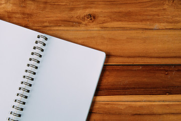 Blank notepad on office wooden table